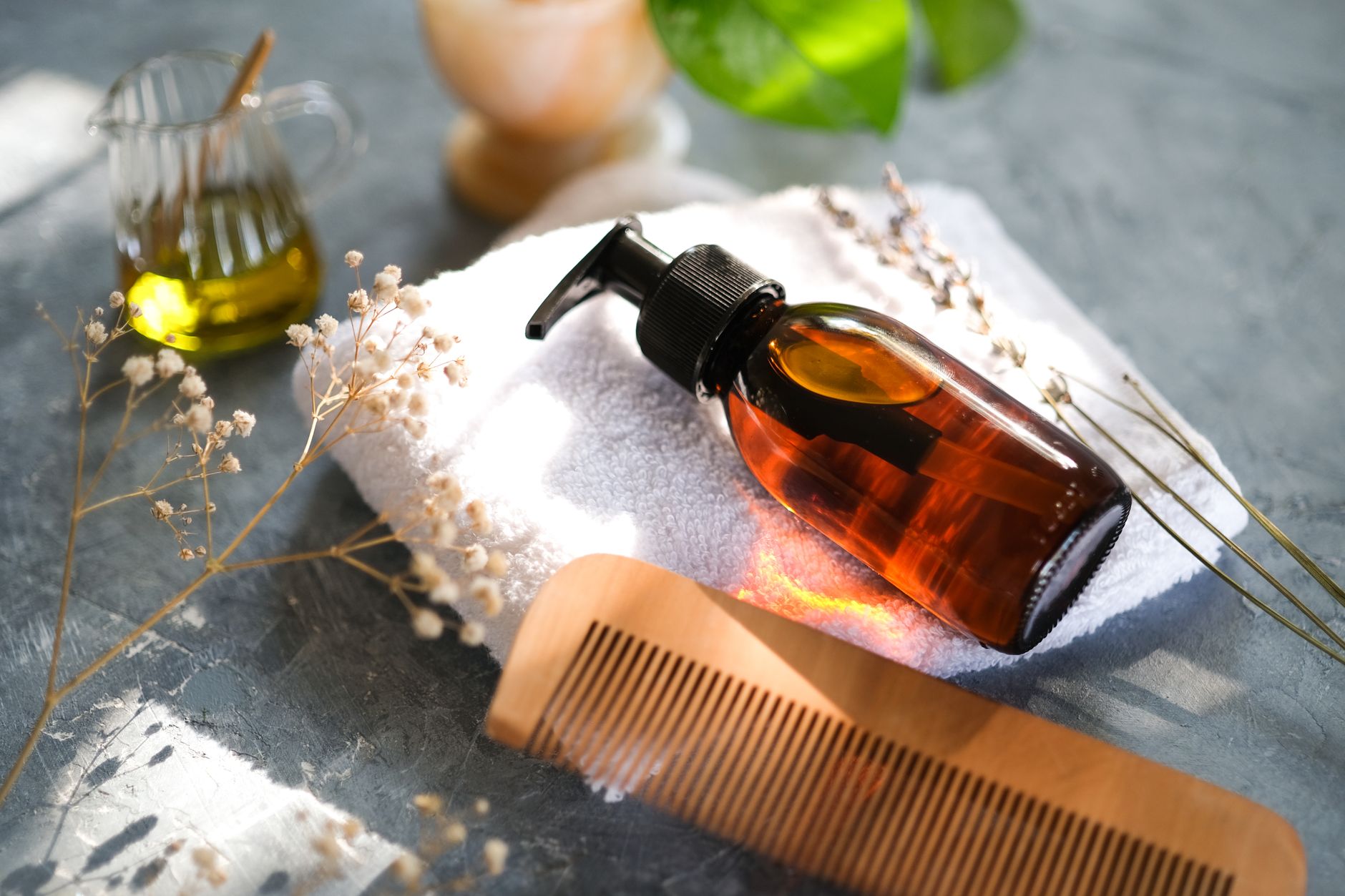 comb and bottle of cosmetic