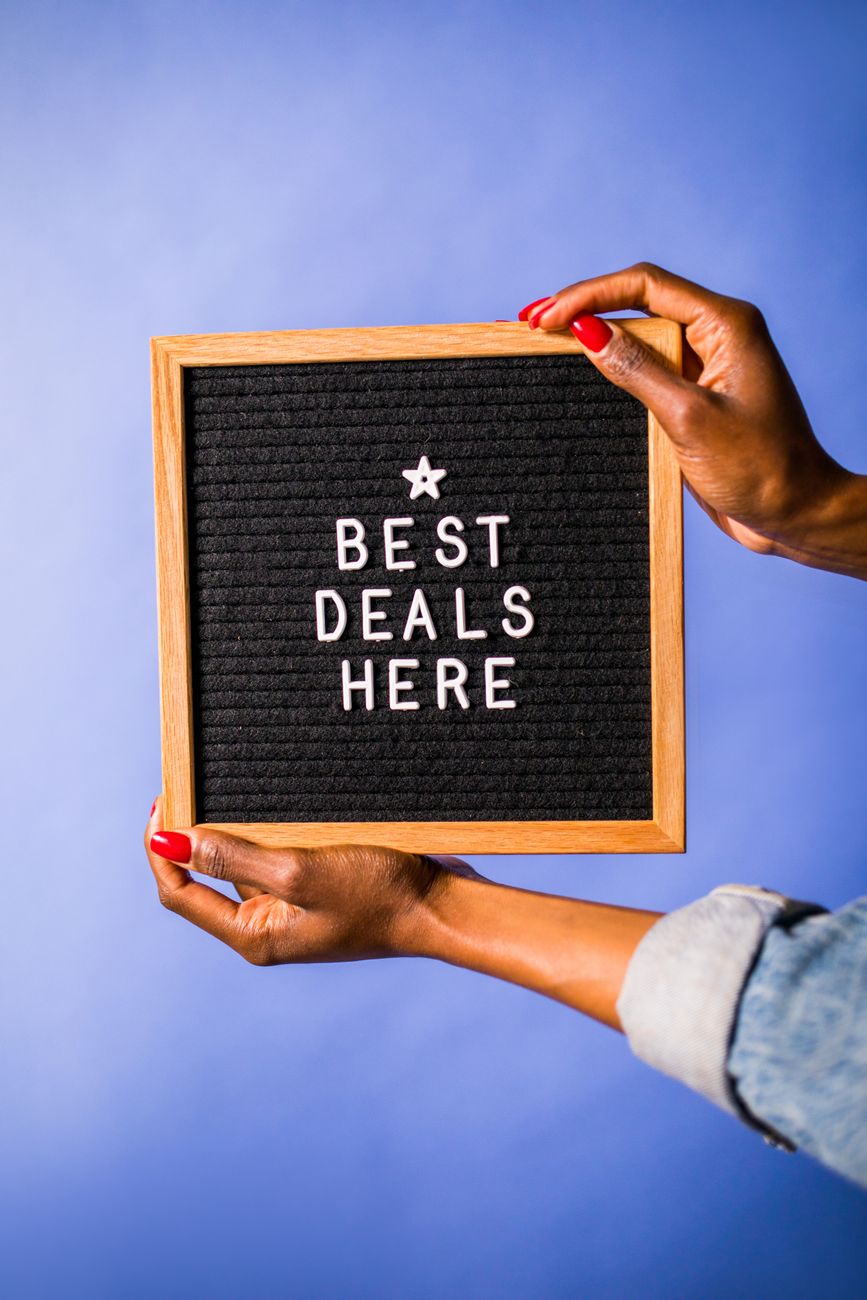 a person holding a letter board